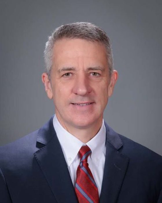 Portrait of John Maddox