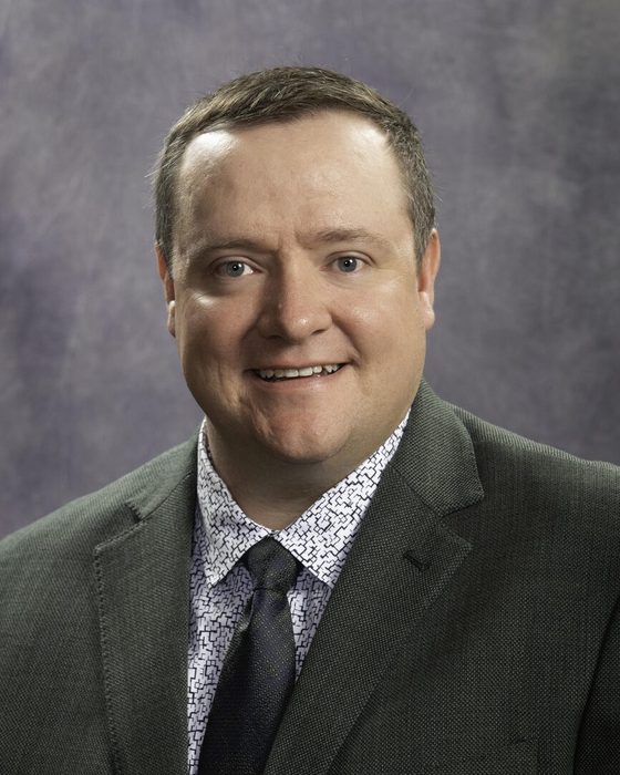 Portrait of Derek Harvey